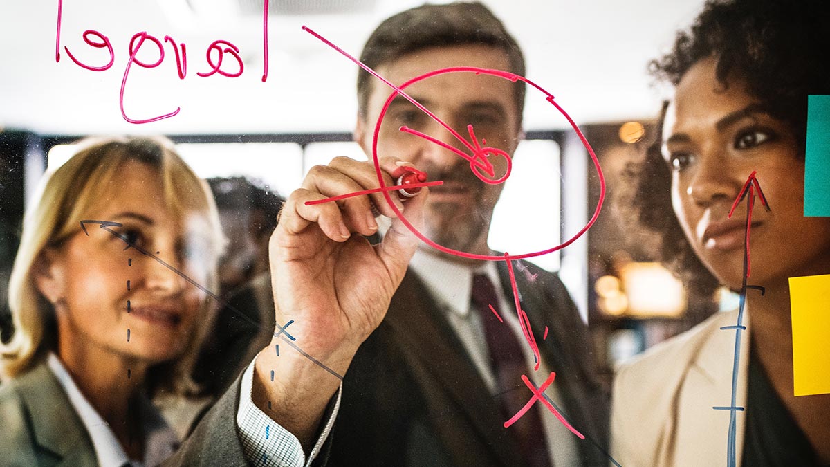 people drawing on glass