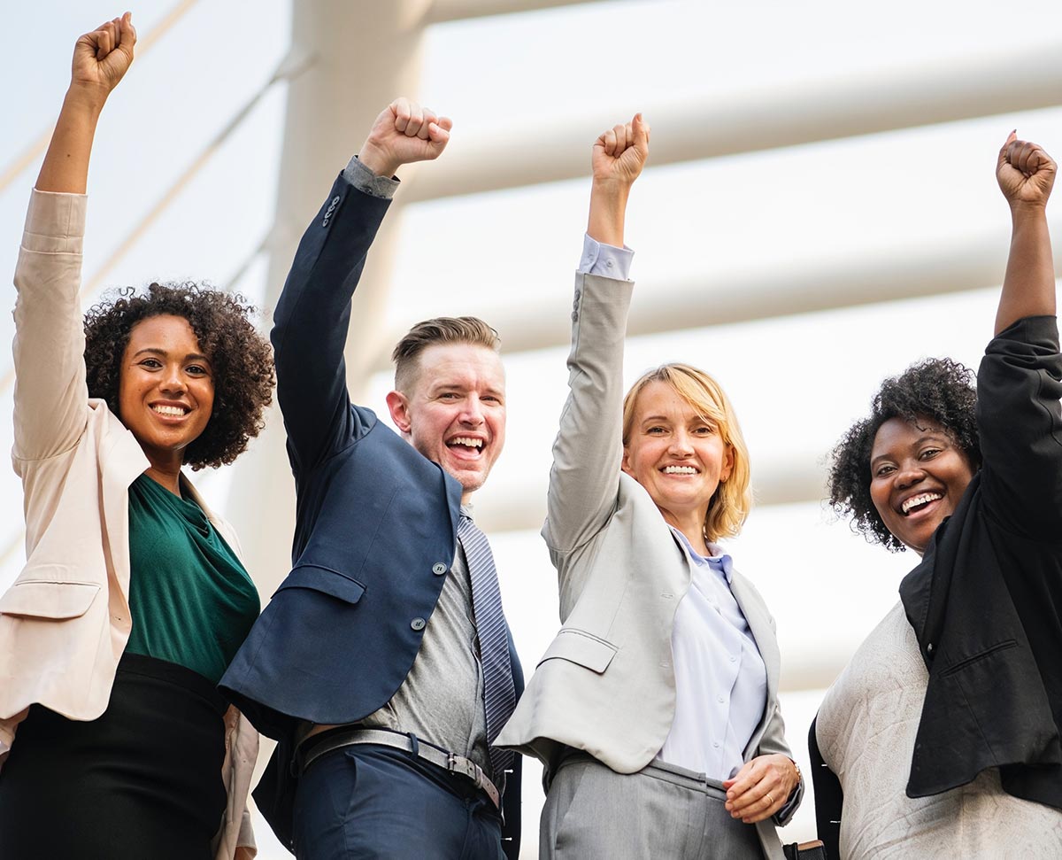 people raising arms happily